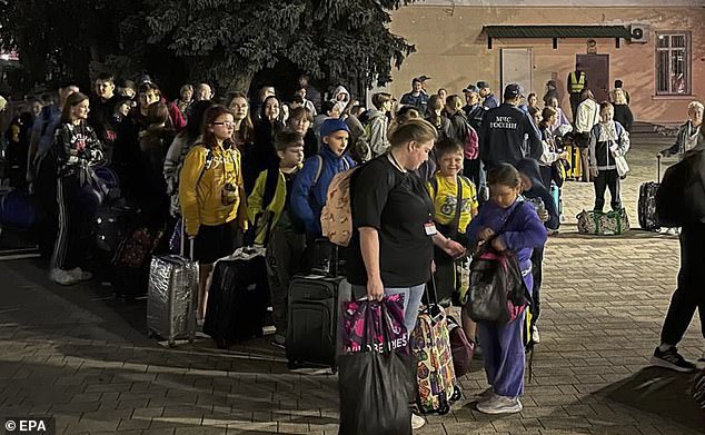 A picture provided by the press service of the Russian Emergencies Ministry shows people evacuated from the Belgorod and Kursk regions arriving at temporary accommodation points in Nevinnomyssk in Stavropolsky Kray, Russia.