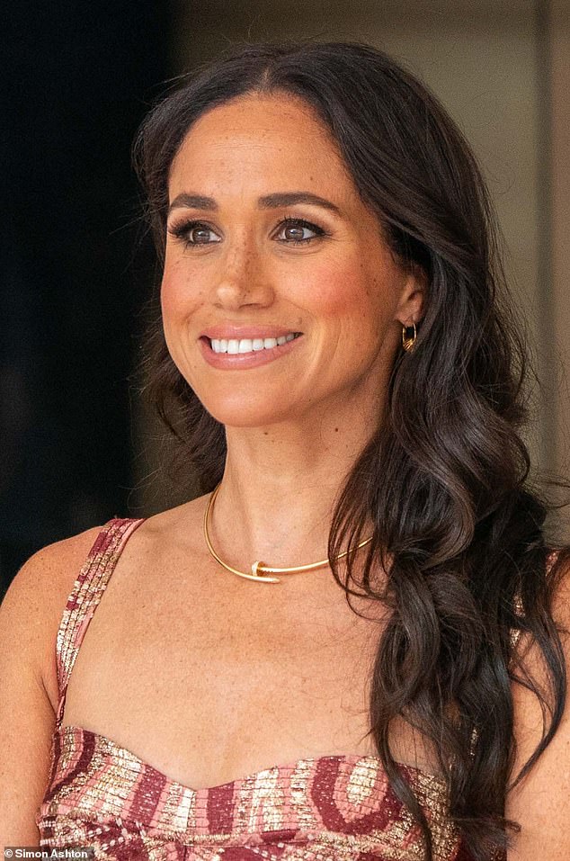 Meghan was photographed wearing her £12,800 yellow gold Cartier Juste Un Clou necklace with her £150 gold Lanvin Arpège Sleeper earrings.