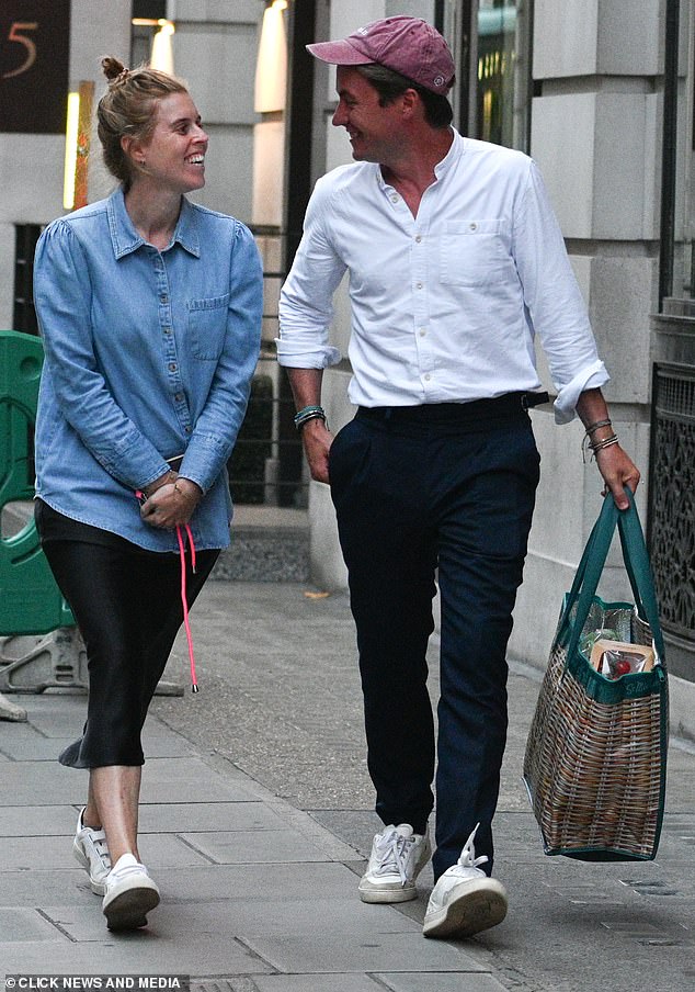 Beatrice, daughter of Sarah Ferguson and Prince Andrew, wore a casual oversized denim shirt and a black midi skirt.