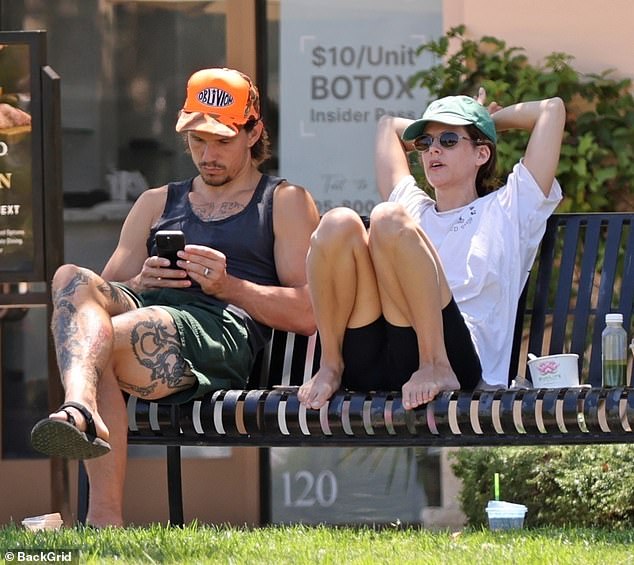 Dressed in a simple white T-shirt and black cycling shorts, Elvis Presley's granddaughter sat barefoot, biting her lip as she sat on the bench.