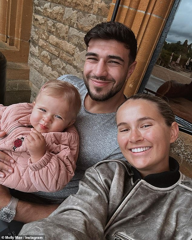 According to confidential sources, Molly-Mae, 25, became suspicious during Tommy's 2021 boxing training camp in Las Vegas with his brother, Tyson Fury (pictured with daughter Bambi).