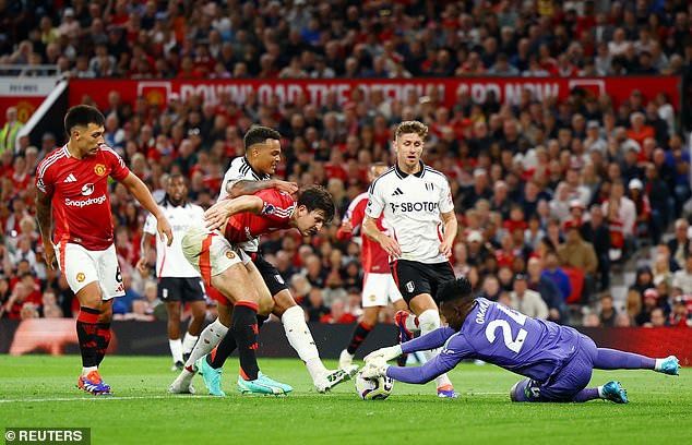 Andre Onana dived to the ground to pick up a loose ball in a tense finale at Old Trafford