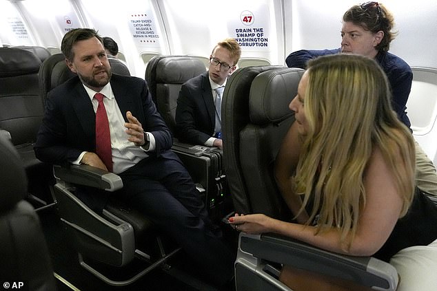 Vance speaks to reporters on his plane during a campaign trip to Virginia last month.