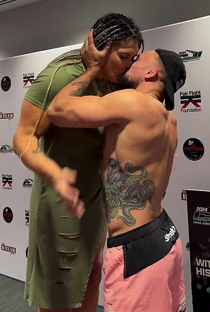 Jones shared a kiss with Gabi Garcia, who she is supposed to face on Saturday night.