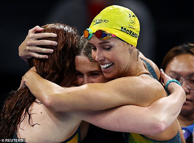 Emma McKeon (right) celebrating with her teammates after Australia won the 4x100m freestyle relay at the Paris Olympics