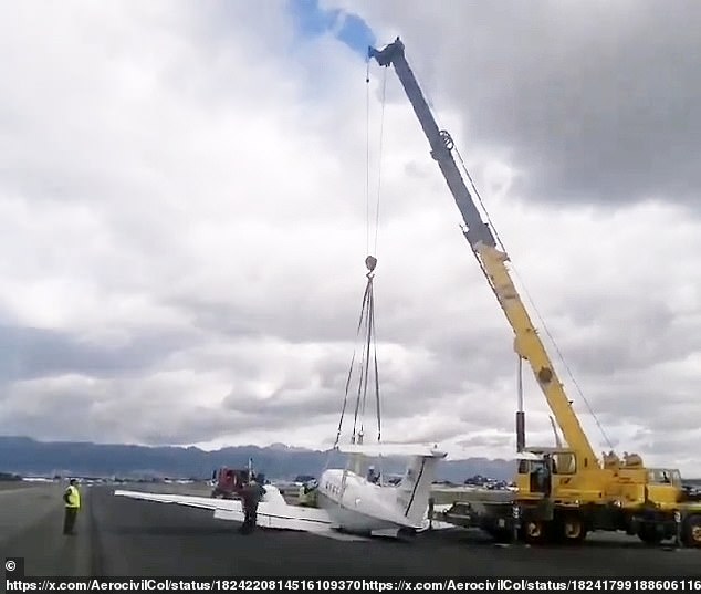 A crane was used to remove the US Air Force plane that made an emergency landing at an airport in Bogota, Colombia, on Thursday.