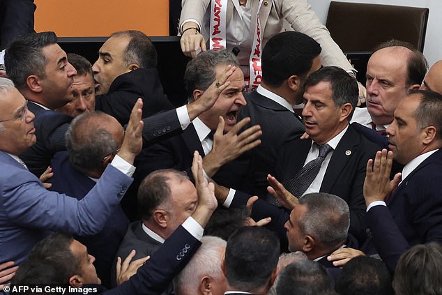 Shocking scenes from inside the Turkish parliament were televised as the fighting continued.