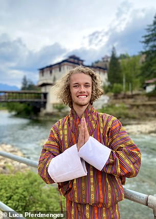 The traveler wearing traditional Bhutanese clothing in Paro, Bhutan, one of his favorite countries