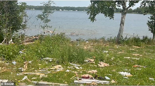 Some debris ended up in a nearby lake, pictured above, after the explosion.