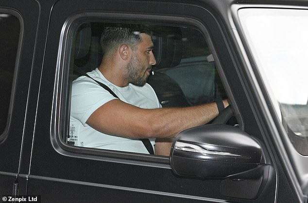 The professional boxer looked dejected as he pulled into the driveway of the house in his £180,000 Mercedes G Wagon.