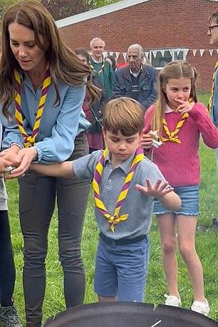 Prince Louis enjoys toasted marshmallows as he takes part in Big Help Out, during a visit to the Upton Scouts' third hut in Slough, west London, on May 8, 2023.