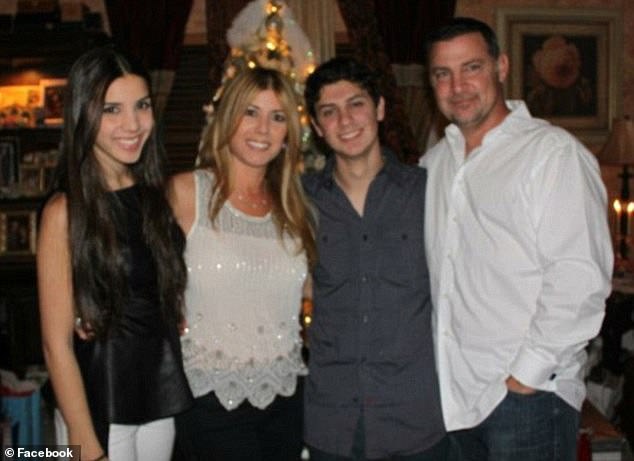 Rey is photographed with his wife Lissette Rey and their children before his death.