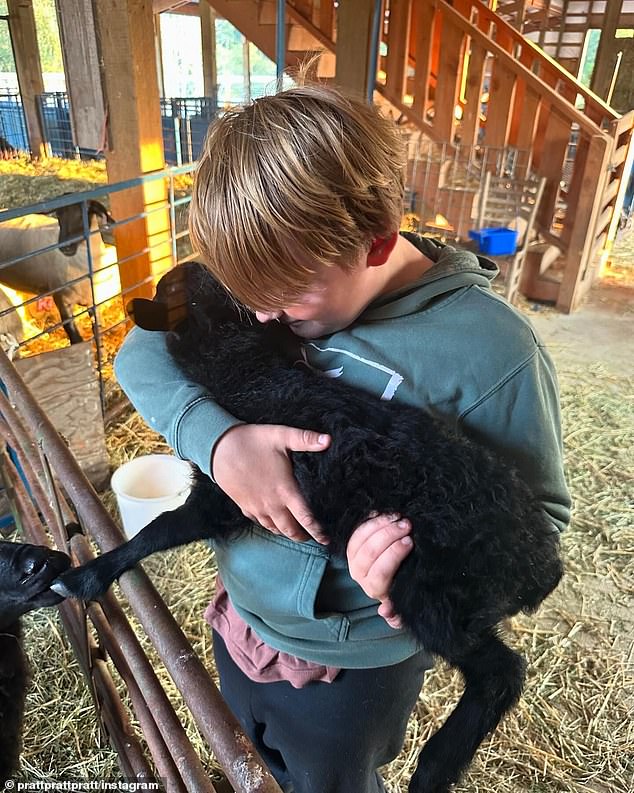 In another photo Pratt shared, his son was cradling an adorable lamb.