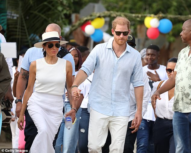 Harry and Meghan are seen on the streets of San Basilio de Palenque during their visit to Colombia