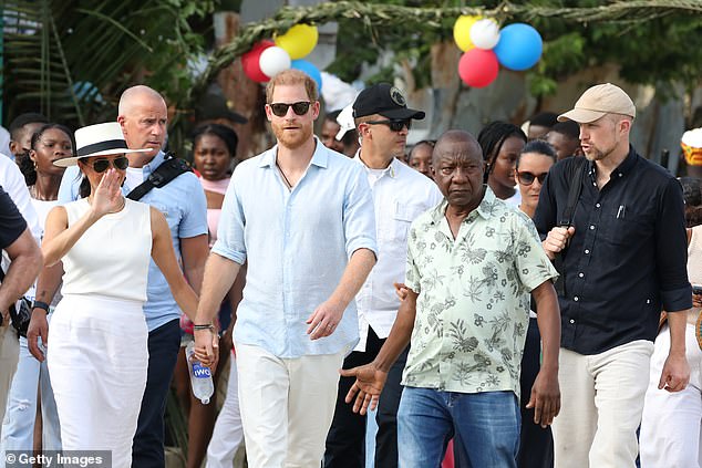 Meghan and Harry were accompanied by security as they walked through the streets.