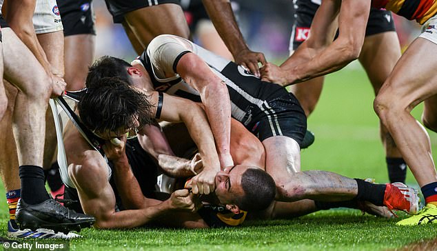 Rachele's gesture backfired as his team lost by 22 points and crashed out of the final, and he became involved in a heated fight with Port stars Zak Butters and Connor Rozee (pictured).