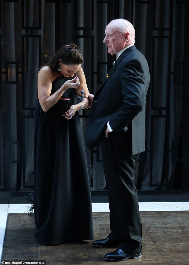 Georgia looked half her age in the classic silhouette as she pulled her brunette hair back into a half-updo and touched up her lipstick before the main event.