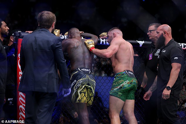 Du Plessis is seen consoling Adesanya just after his rear-naked choke ended the fight.