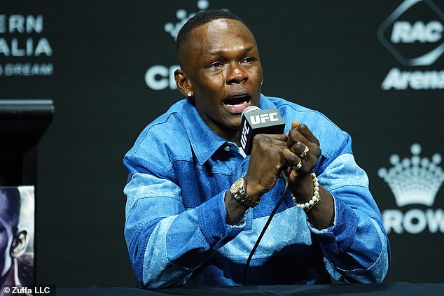 Nigerian-born Adesanya burst into tears at Friday's pre-fight press conference (pictured) when Du Plessis made a comment about his background.