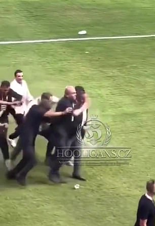 The Fenerbahce president stood up and managed to walk away unassisted while being protected by security personnel.