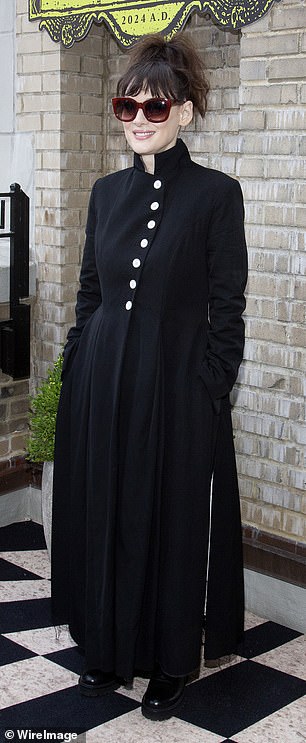 Winona appeared at Saturday's photocall, which took place at JW Marriott Essex House, wearing a black coat dress.