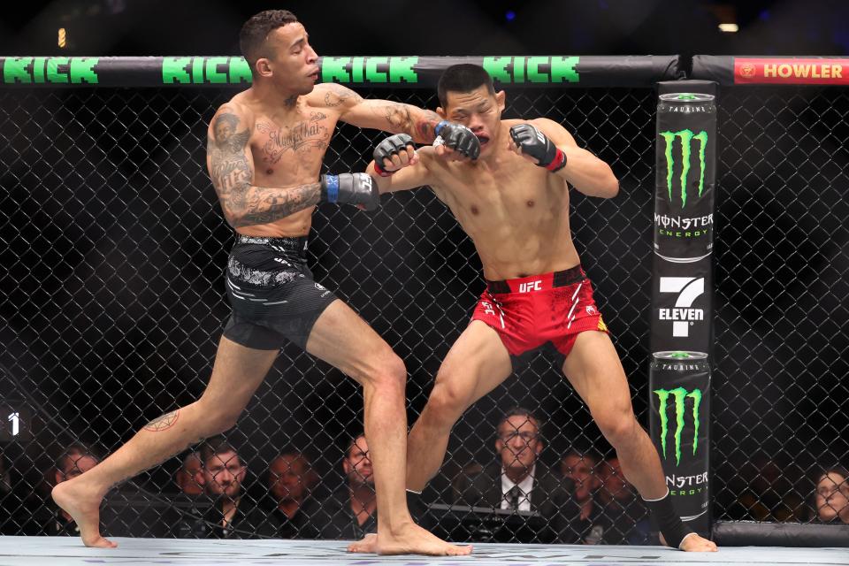 China's Li Jingliang (in red) and Brazil's Carlos Prates will fight at their Ultimate Fighting Championship (UFC) 305 men's welterweight event at the Perth Arena in Perth on August 18, 2024. (Photo by COLIN MURTY / AFP) / -- IMAGE RESTRICTED TO EDITORIAL USE - STRICTLY NO COMMERCIAL USE -- (Photo by COLIN MURTY/AFP via Getty Images)