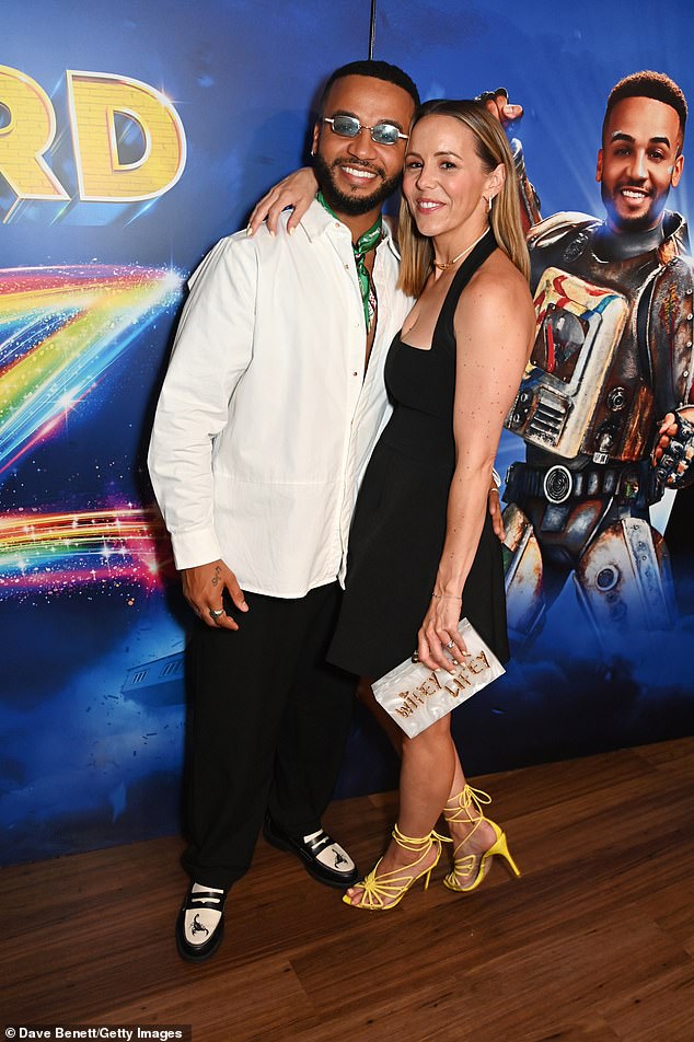 Following the performance, Aston was spotted on the red carpet with his wife Sarah Richards, 40, wearing a white shirt and black trousers and black and white brogues.