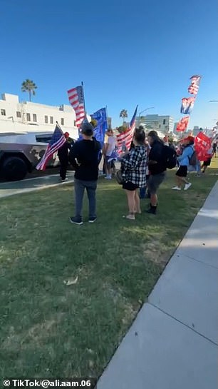 Trump supporters, holding American flags and pro-Trump signs, began chanting Kanye's name when they recognized him behind the wheel.