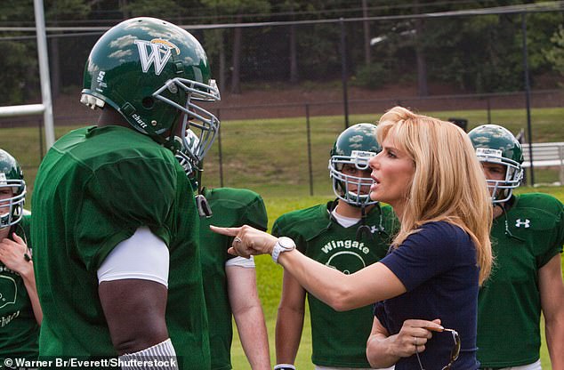 In the film, a character played by Oher is taken in by the Tuohy family, played by Sandra Bullock and country singer Tim McGraw.