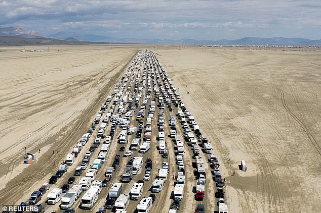 Last year, a mass exodus consumed the festival as fed-up revelers fled Nevada's Black Rock Desert after torrential rains turned the drug- and orgy-filled experience into a muddy mess. (pictured: a massive traffic jam as people tried to leave the festival)