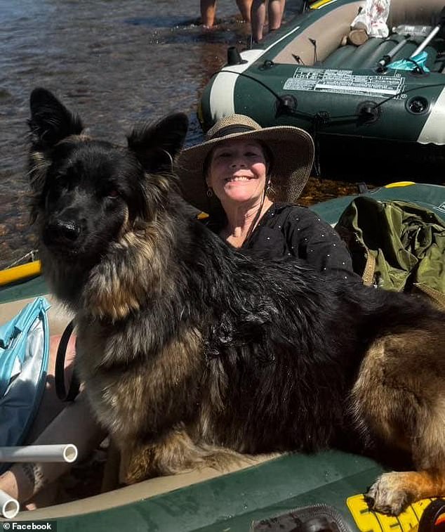 Mary Marshall, 63, posed for a happy snap with her German shepherd named Suki on the raft before the group set off, grinning from ear to ear in excitement for the annual trip.