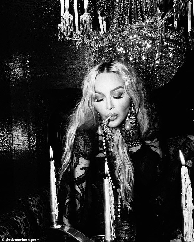 She posed with a cigarette for another artistic black-and-white snap on the carousel.