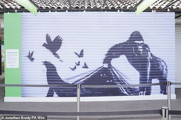 Banksy's latest work shows a gorilla letting other animals escape from the zoo