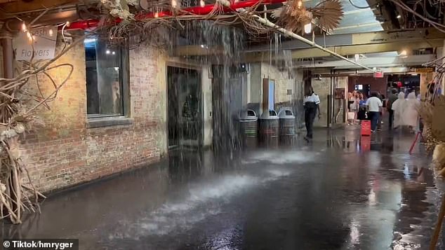 Meanwhile, in Manhattan, shocking video shows the moment water cascades through the roof of the iconic Chelsea Market, completely flooding the food hall.