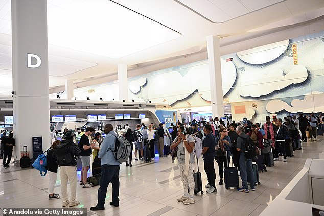 Passengers wait for flights to resume at LaGuardia Airport. Hundreds of planes were grounded due to heavy rain in New York City, the United States, on August 19, 2024.