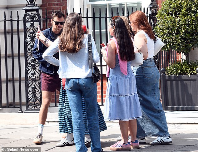 Harry made the most of the British summer on Sunday as he was seen sunbathing in shorts before being mobbed by fans.