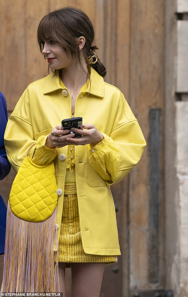 Emily never skimps on accessories – just check out the head-to-toe yellow Twiggy-inspired ensemble (pictured) she wears in one episode.