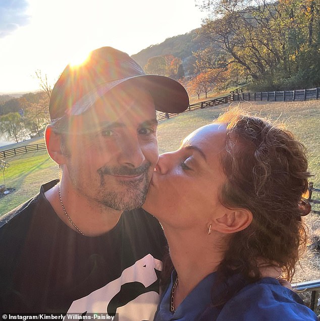 Although she hasn't been able to speak properly for the past two years, the actress said she found her voice in other ways. She is pictured here with her husband, country singer Brad Paisley.