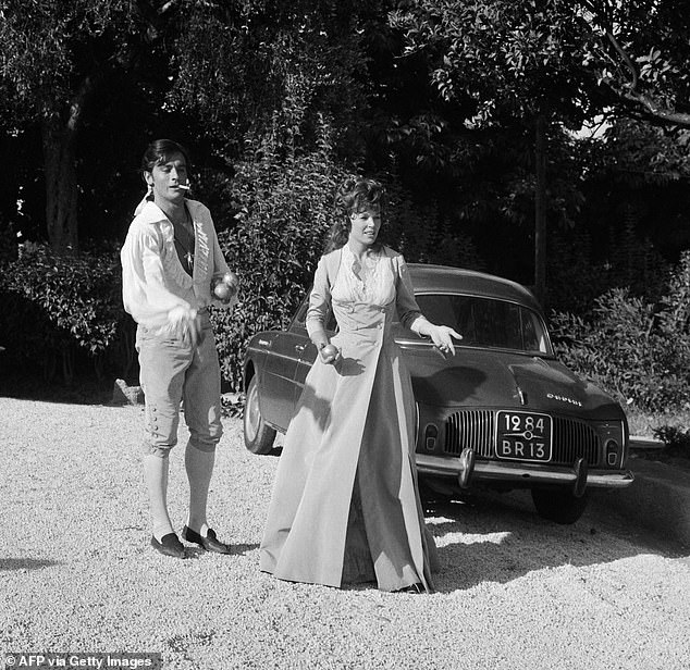 This photograph taken on August 21, 1963 in Nice shows French actor Alain Delon (left) and British actress Dawn Addams during the filming of 'The Black Tulip' (La Tulipe noire).