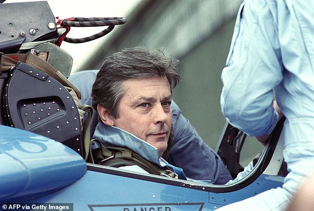 French actor Alain Delon poses on April 18, 1988 aboard an Alphajet of the Patrouille de France of the French Air Force in Salon-de-Provence