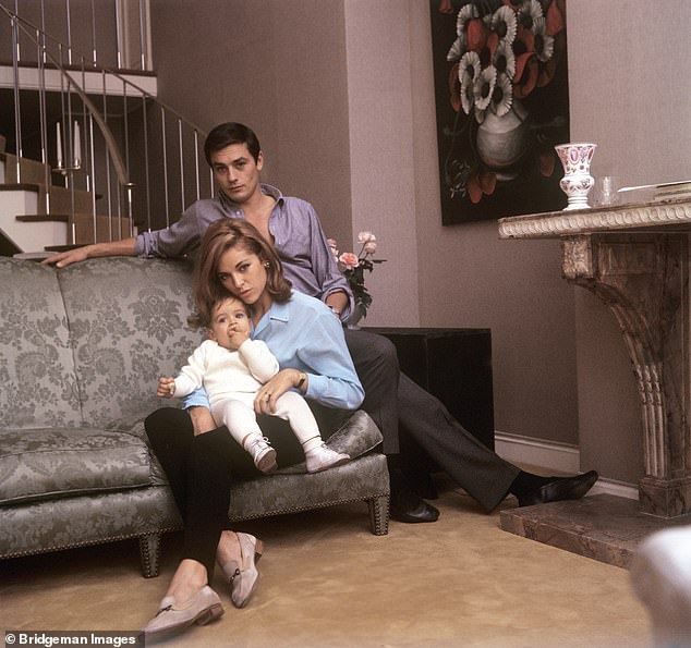 Alain Delon, at his home in Paris, with his wife Nathalie (Francine Canovas) and his son Anthony Delon in 1964