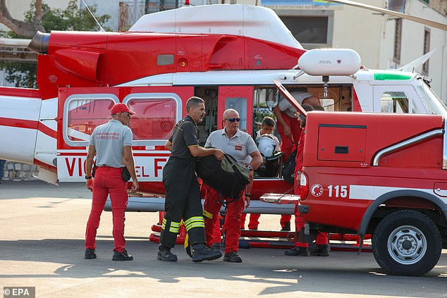 Cave divers arrive to join the rescue operation in Palermo, Sicily, on August 19.