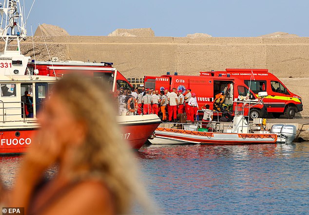 Experienced cave divers for deep-sea recoveries arrive at the dock as the rescue operation continues for missing people who were aboard a sailing boat that sank, in Palermo, Sicily, Italy, August 19.