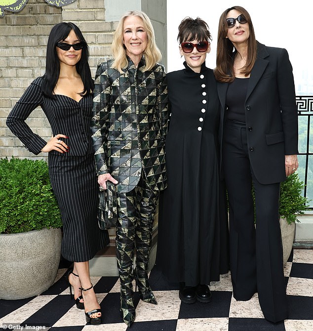 Last weekend, Jenna modeled a black pinstripe skirt suit by Dolce & Gabbana for a Beetlejuice photo shoot; pictured with her co-stars Catherine O'Hara, Winona Ryder and Monica Bellucci.