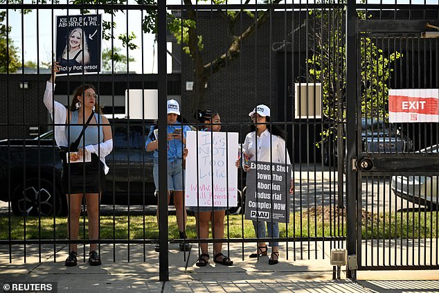 A group of anti-abortion protesters gathered outside the door where Planned Parenthood Great Rivers provided free abortions and vasectomies.