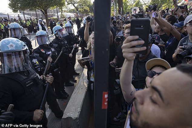 Protesters tore down the DNC's outermost barricade and invaded the area before being repelled by authorities.