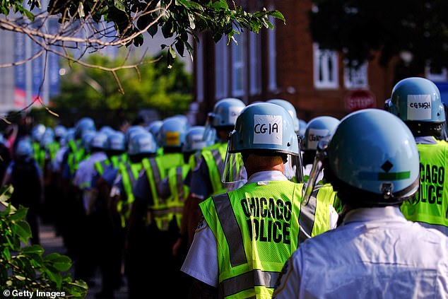 Police officers wearing riot gear such as visors forced the activists to leave the park.