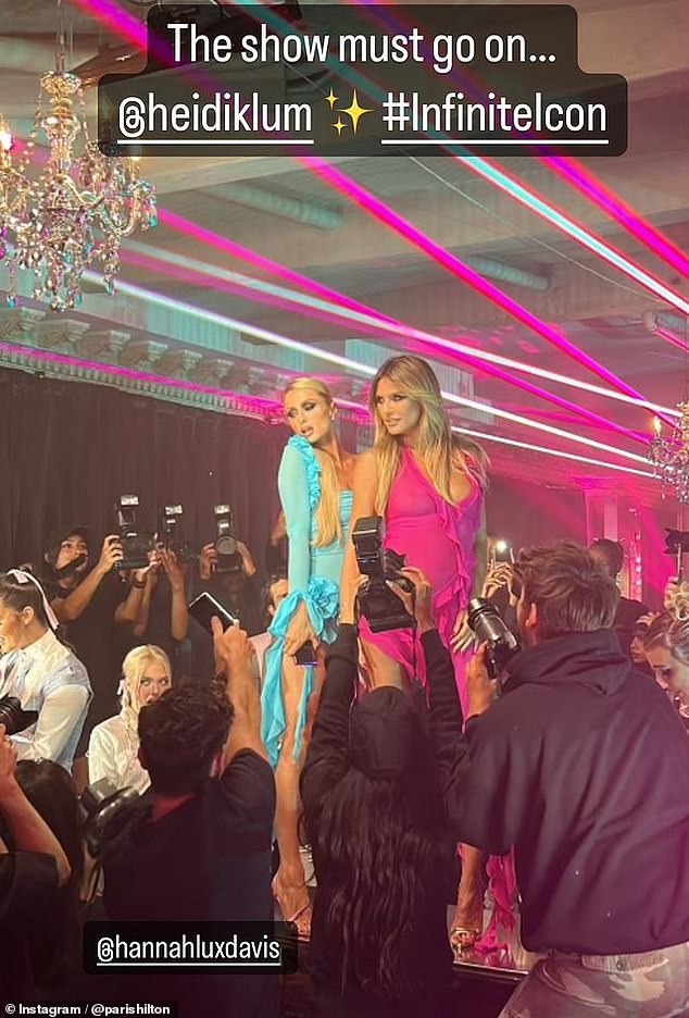 Later on Friday, Hilton posted a photo on Instagram Stories of herself and Heidi Klum posing on a runway, dressed in glamorous, skin-baring ensembles.