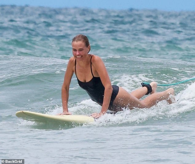 She was seen having the time of her life as she surfed the waves in Central America and showed off her incredible skills on a board.