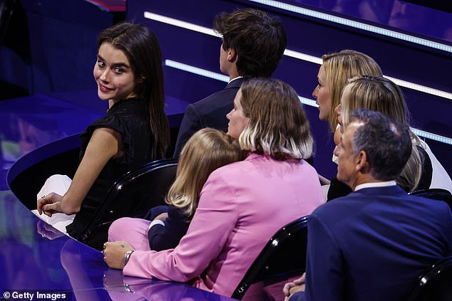 Natalie Biden (left), one of the president's granddaughters, sits next to her brother Hunter and looks at her cousin Maisy Biden and baby Beau.